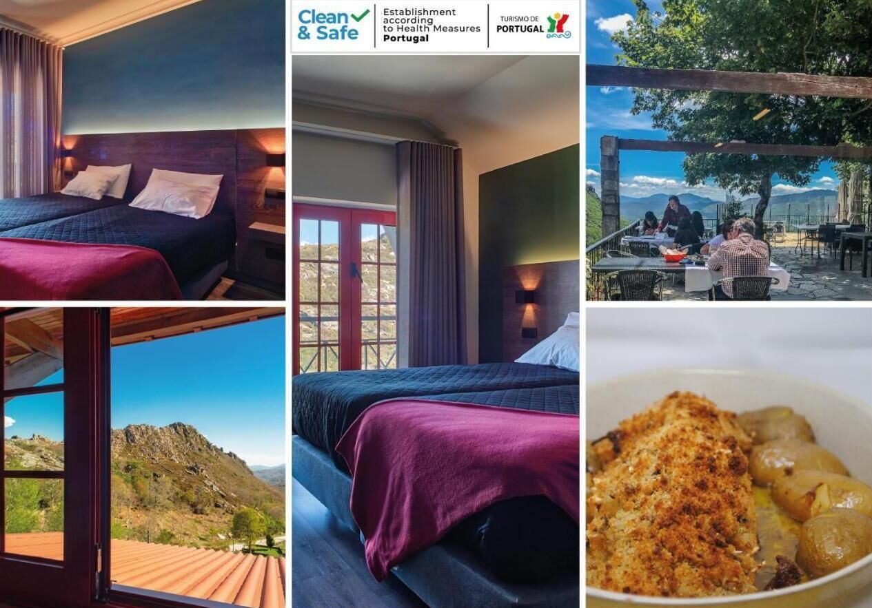 A hotel room with a bed, a window with a view of mountains, and a dining area with people.