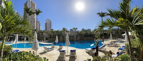 5 outdoor pools, open 8:00 AM to 8:00 PM, pool umbrellas, sun loungers
