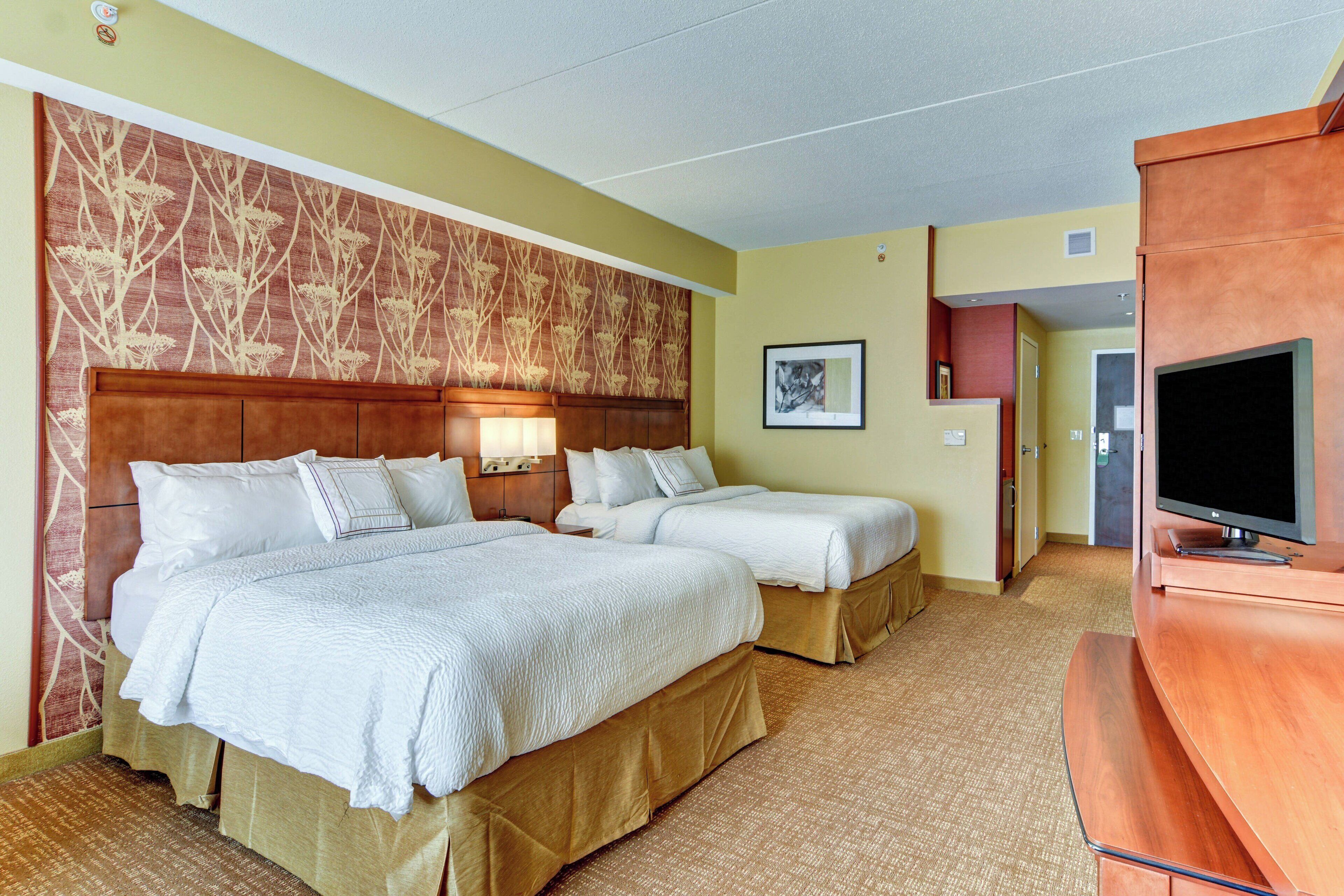 room, 2 double beds | premium bedding, in-room safe, desk, iron/ironing board