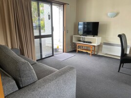 Apartamento | Área de estar | TV