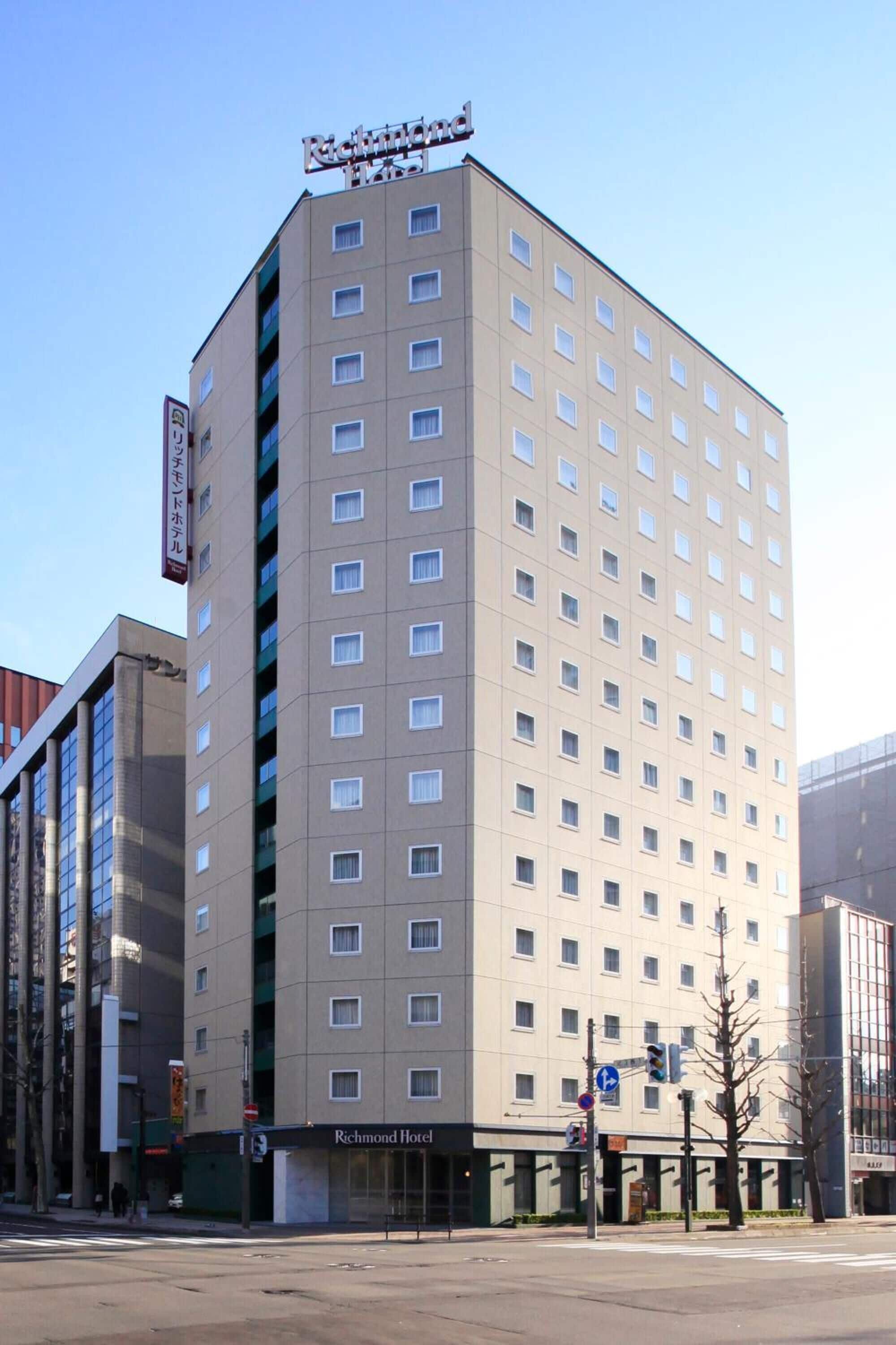 A tall, rectangular hotel building with a flat facade and numerous windows.