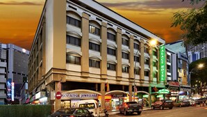A hotel with a modern facade, multiple floors, and a prominent sign for 'Palace Hotel'. - Palace Hotel (Kuala Lumpur)