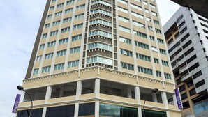 A multi-story hotel with a modern design, featuring a prominent entrance with glass doors and a visible signboard. - Metro Hotel (Kuala Lumpur)