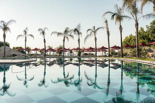 Indoor pool, seasonal outdoor pool, pool umbrellas, pool loungers