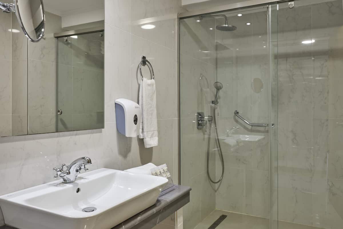 family room, partial sea view | bathroom | hair dryer, towels, soap, shampoo