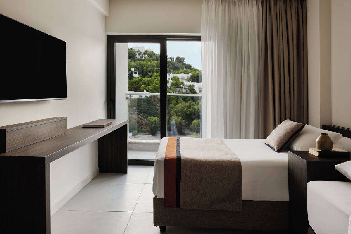 Premium Family Room with Garden View | Free minibar items, in-room safe, desk, blackout curtains