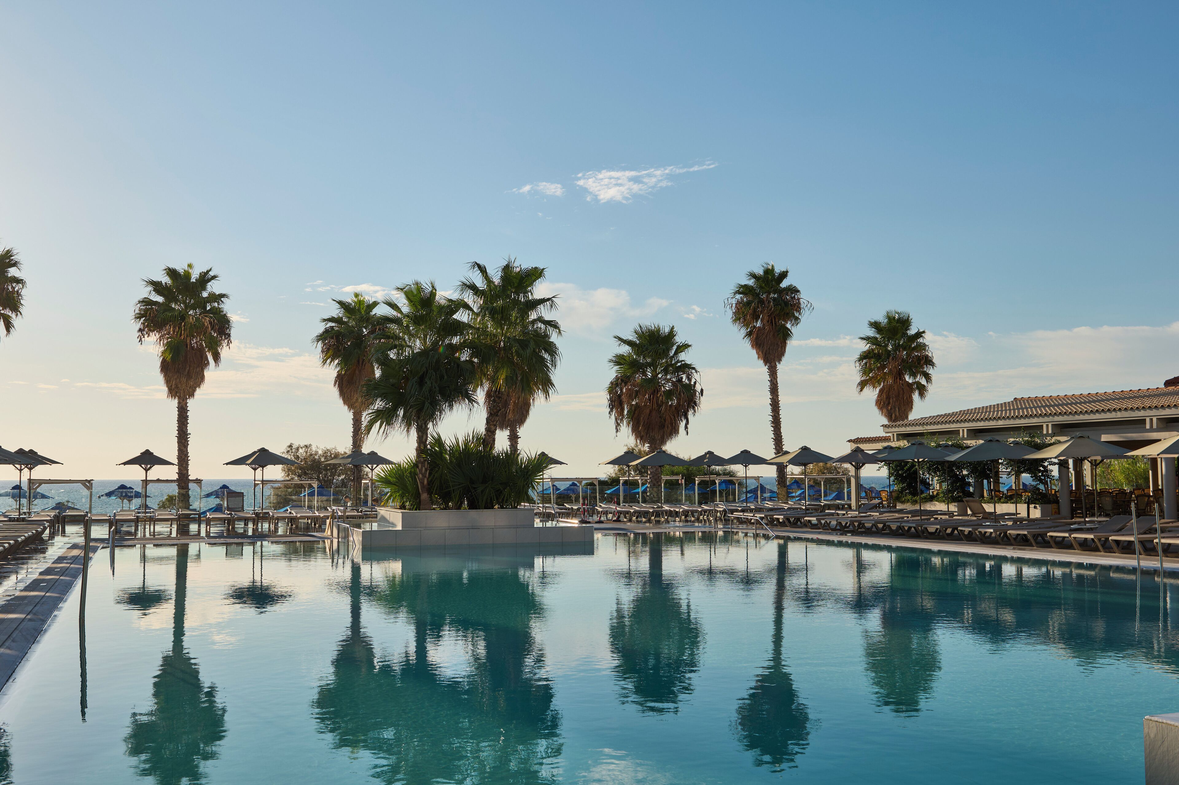 Outdoor pool, pool umbrellas, sun loungers