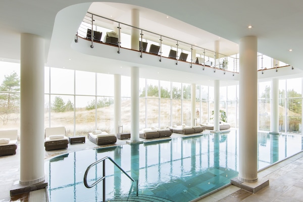 Indoor pool, open 7 AM to 9 PM, sun loungers