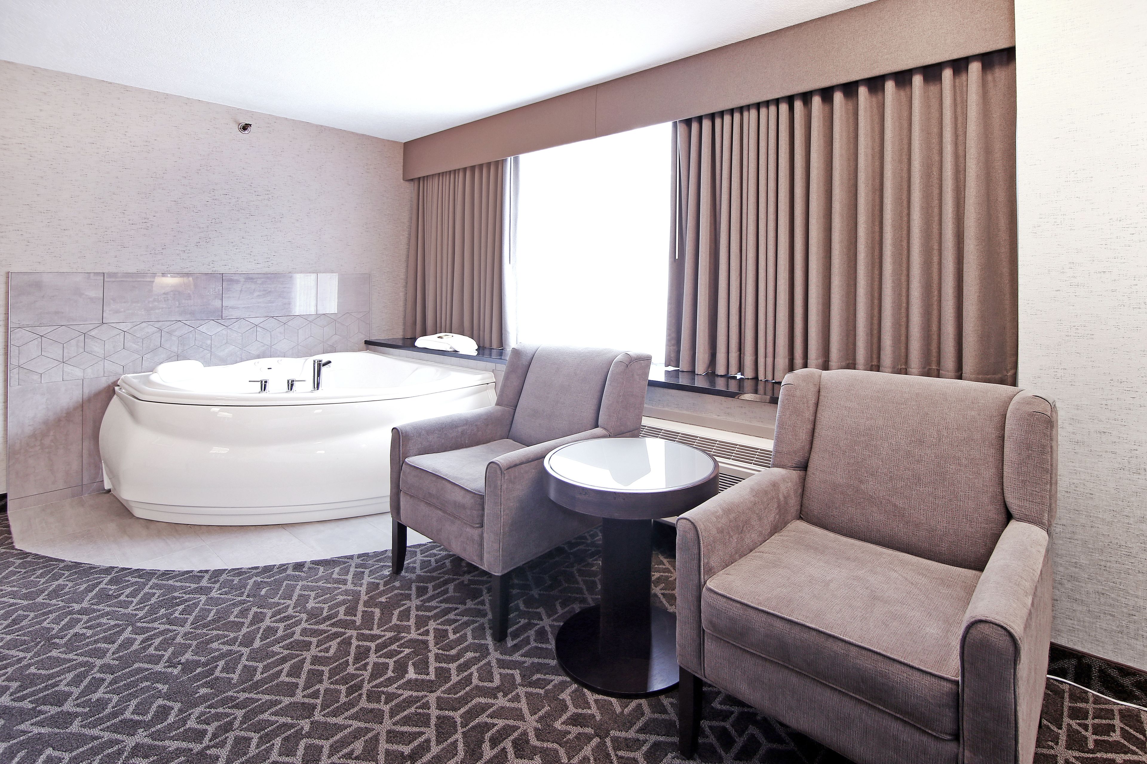 suite, 1 king bed, non smoking, jetted tub | in-room safe, desk, blackout curtains, iron/ironing board