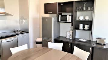 Family Apartment (6 people), 2 Bedrooms, City View | Private kitchen | Fridge, microwave, stovetop, coffee/tea maker