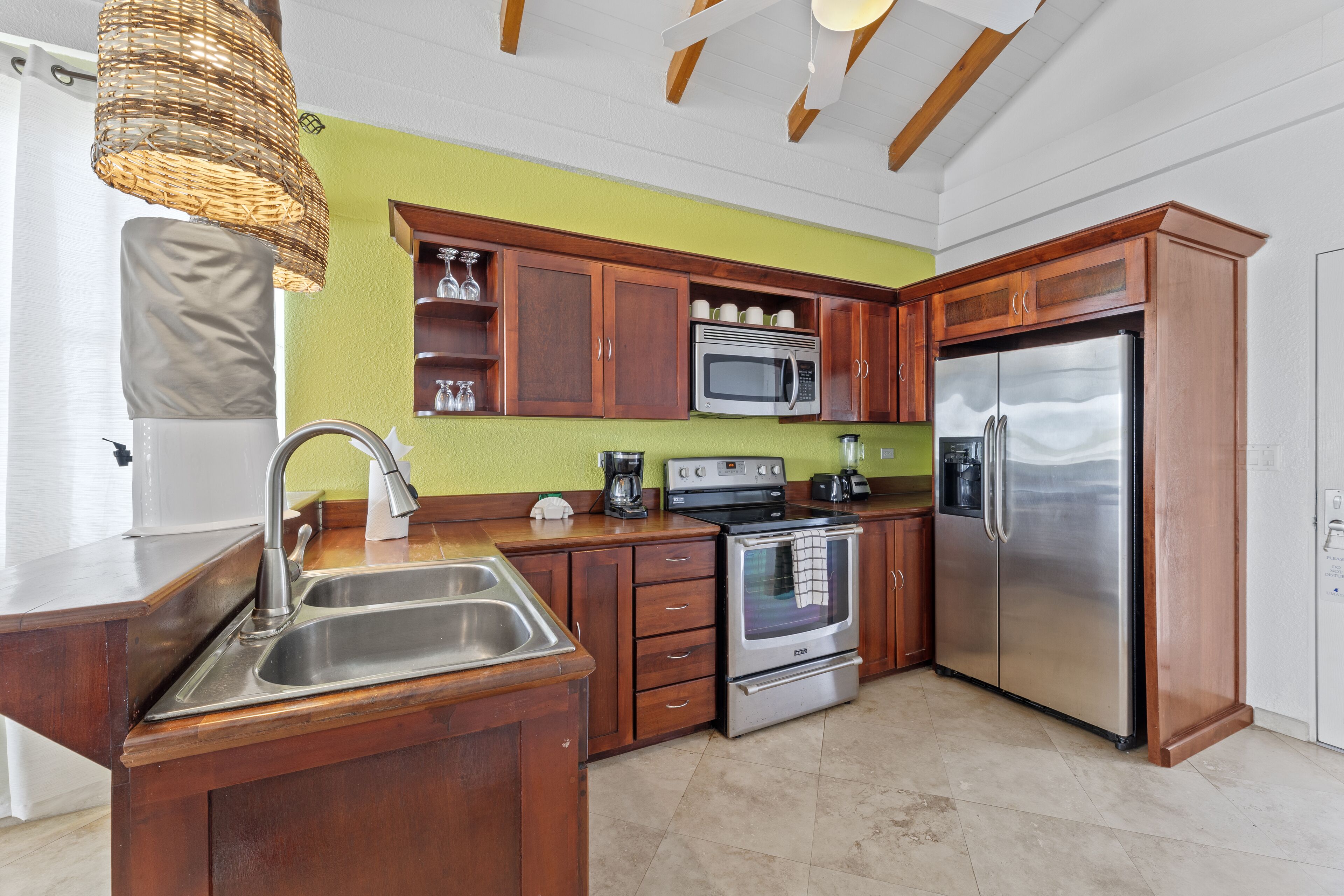 full-sized fridge, oven, stovetop, coffee/tea maker