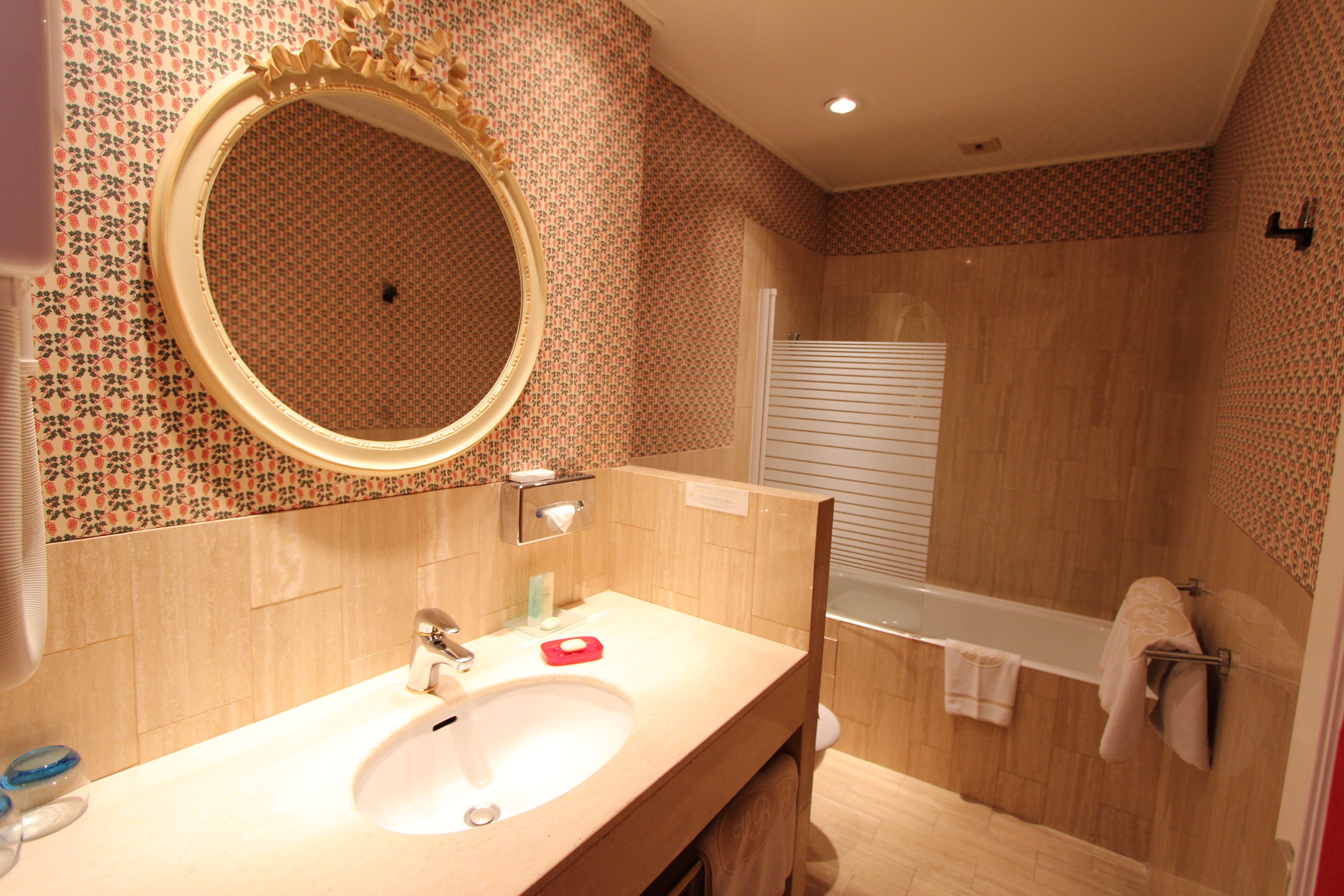 bathtub, free toiletries, hair dryer, towels