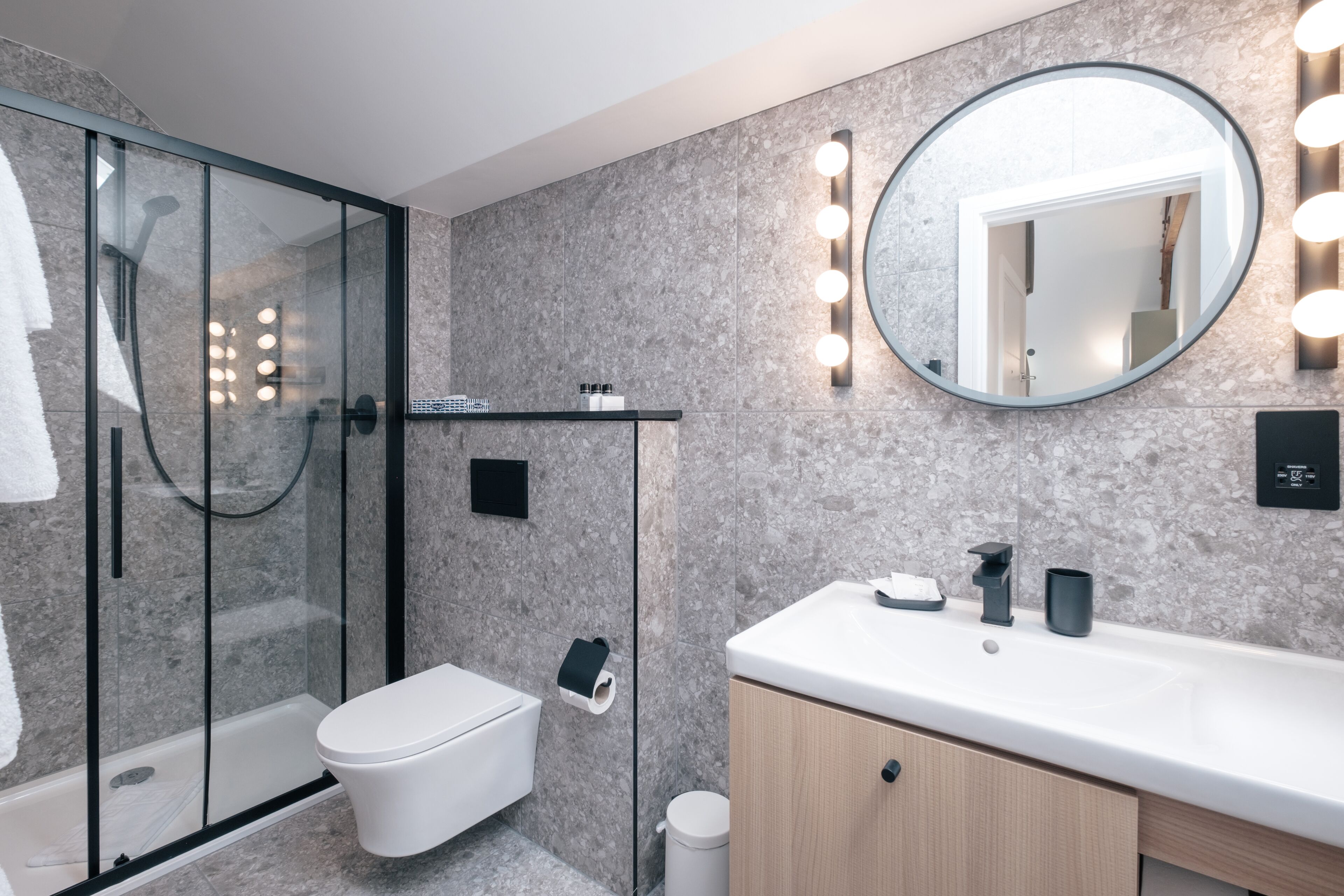 queen single | bathroom | designer toiletries, hair dryer, towels, soap