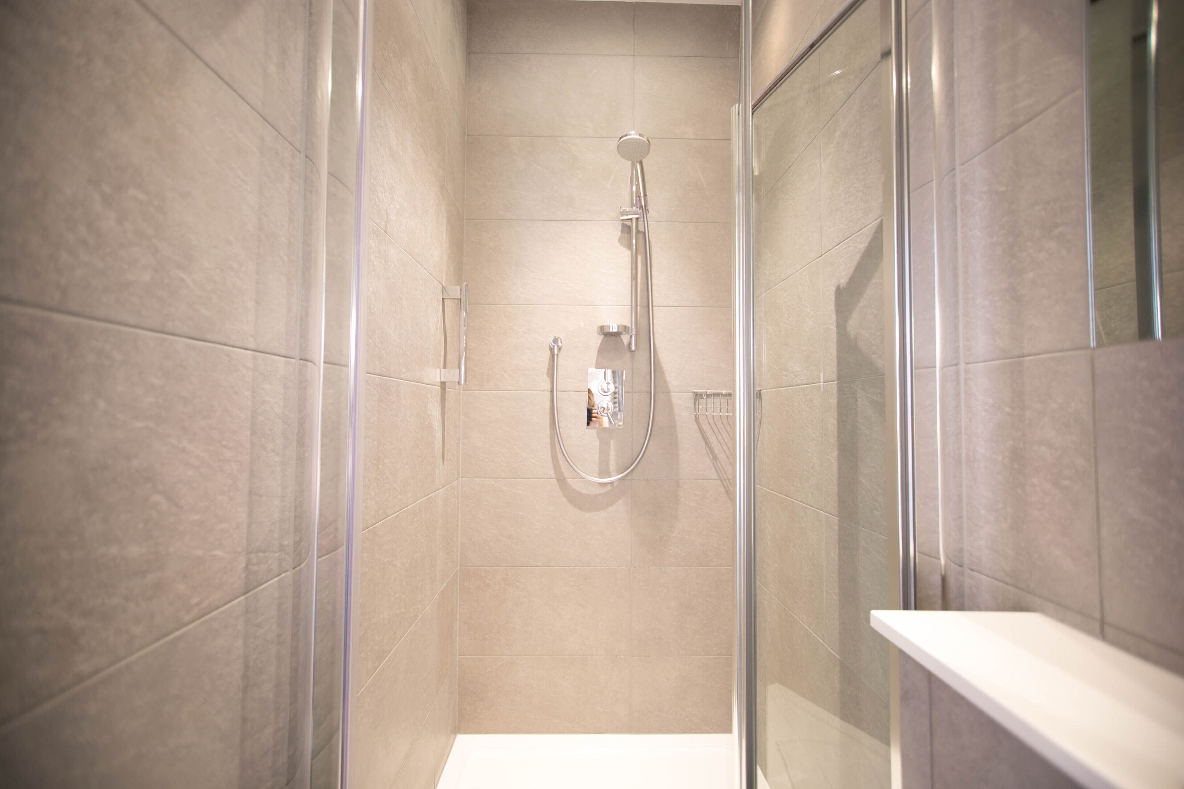 queen room | bathroom | designer toiletries, hair dryer, towels, soap