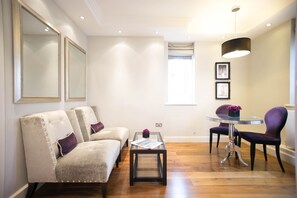 Suite Double or Twin | Living area | 32-inch LCD TV with satellite channels, TV