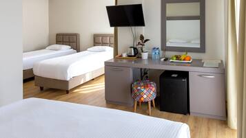 Comfort Quadruple Room | Minibar, in-room safe, desk, laptop workspace