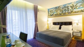 Grand Room, Sea View | Minibar, in-room safe, desk, laptop workspace
