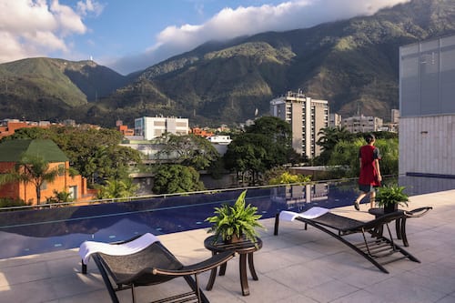 Outdoor pool, open 7:00 AM to 7:00 PM, pool umbrellas, sun loungers