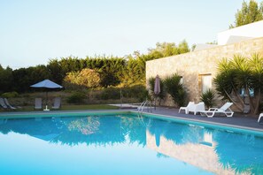 Indoor pool, outdoor pool, open 10:00 AM to 8:00 PM, pool umbrellas