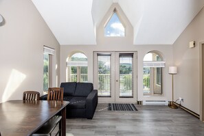 Deluxe Suite, 2 Bedrooms | Living area | TV, fireplace
