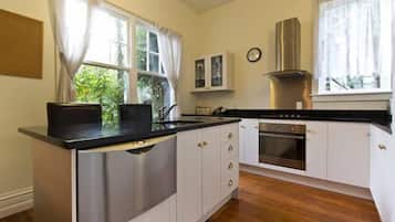 Brockworth Cottage - Riccarton | Private kitchen | Full-size fridge, microwave, oven, stovetop