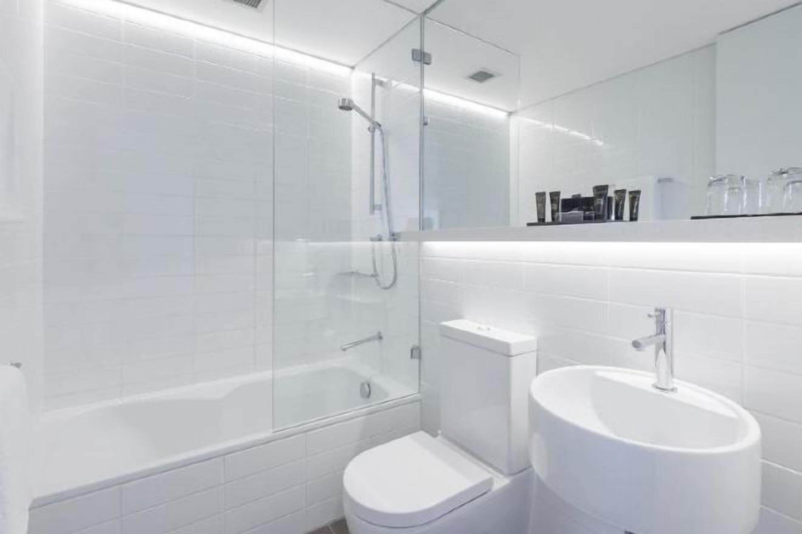 Bathroom | Designer toiletries, hair dryer, towels, soap