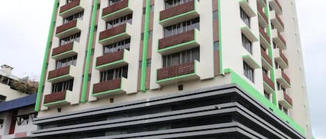 A multi-story hotel with a flat facade, balconies, and a ground-level casino.