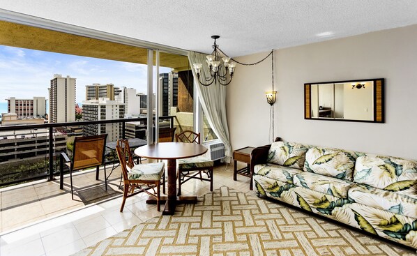 Deluxe room - balcony, mountain OR ocean views | Living room | 42-inch flat-screen TV with cable channels, TV, DVD player