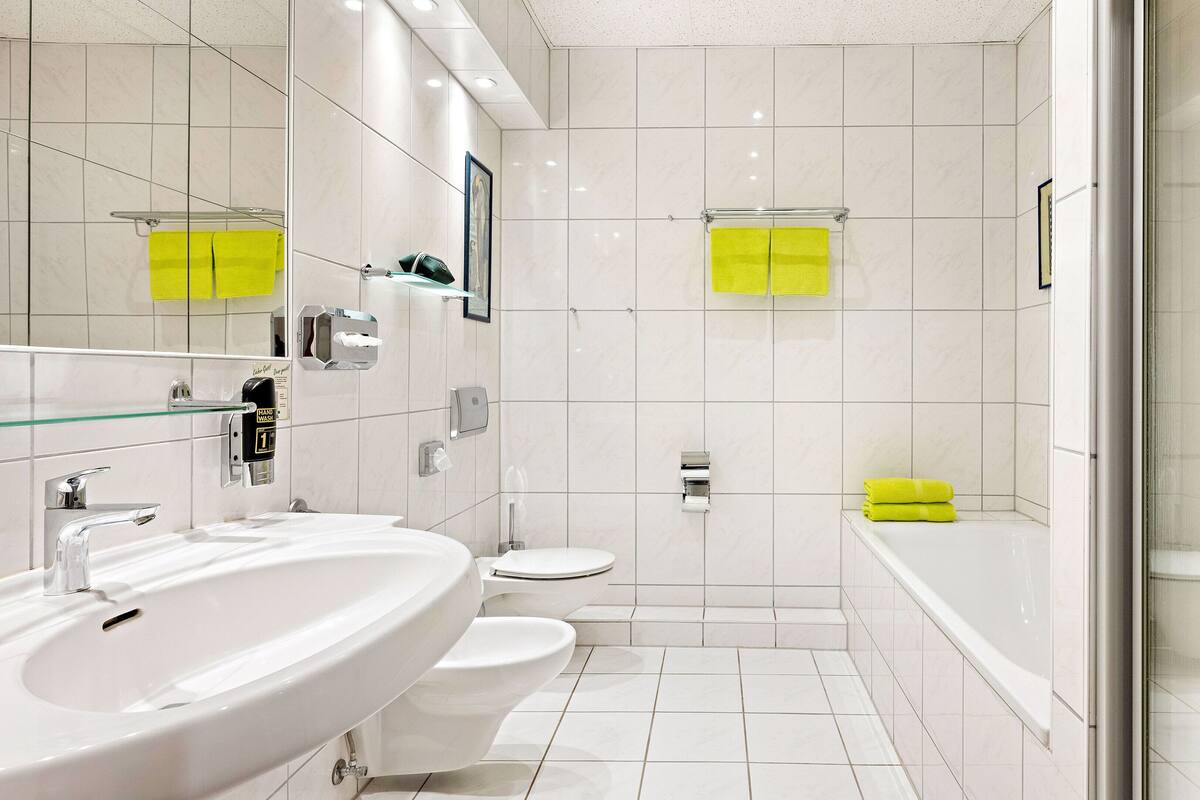 suite | bathroom | shower, hair dryer, towels