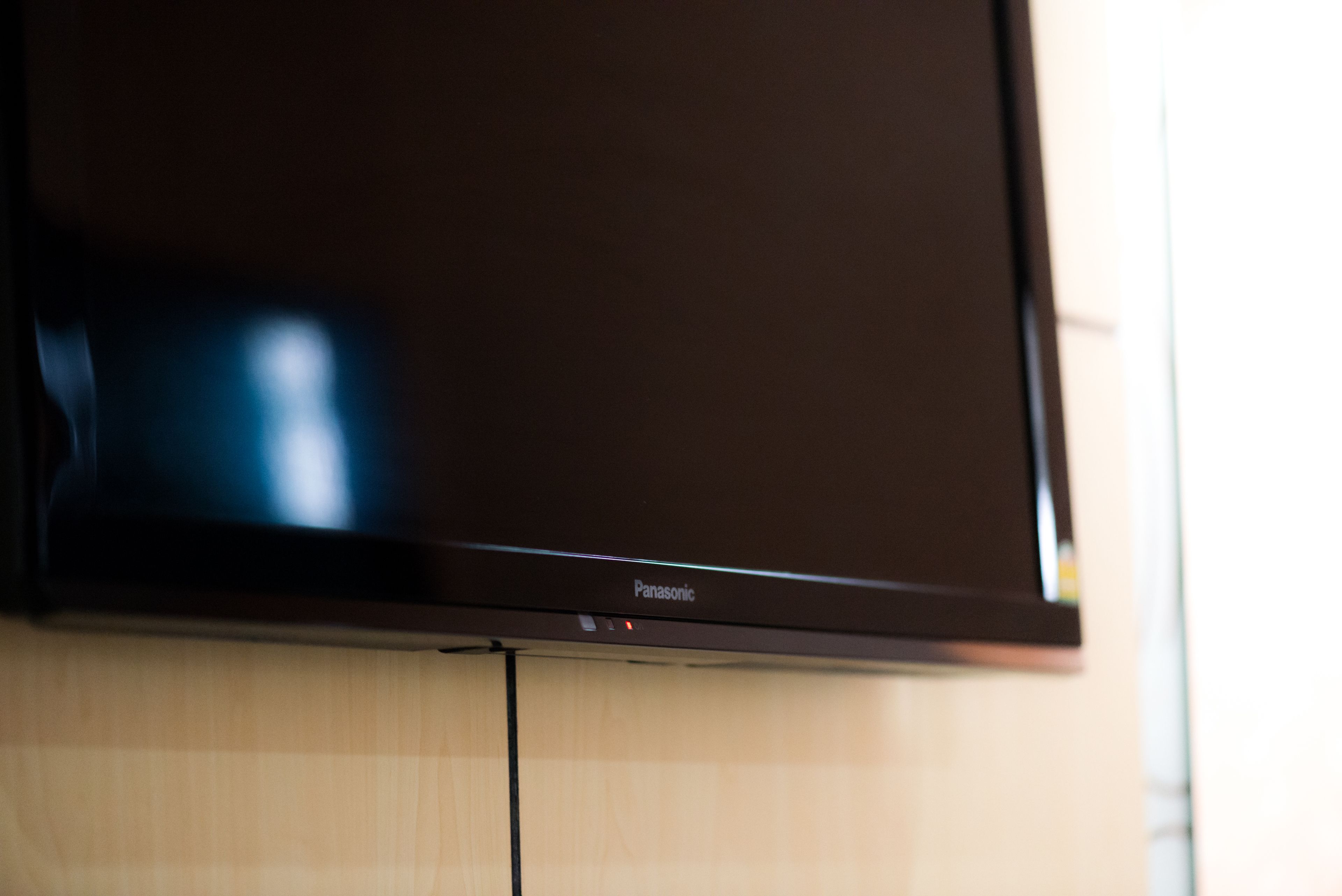 A flat-screen television mounted on a wall.