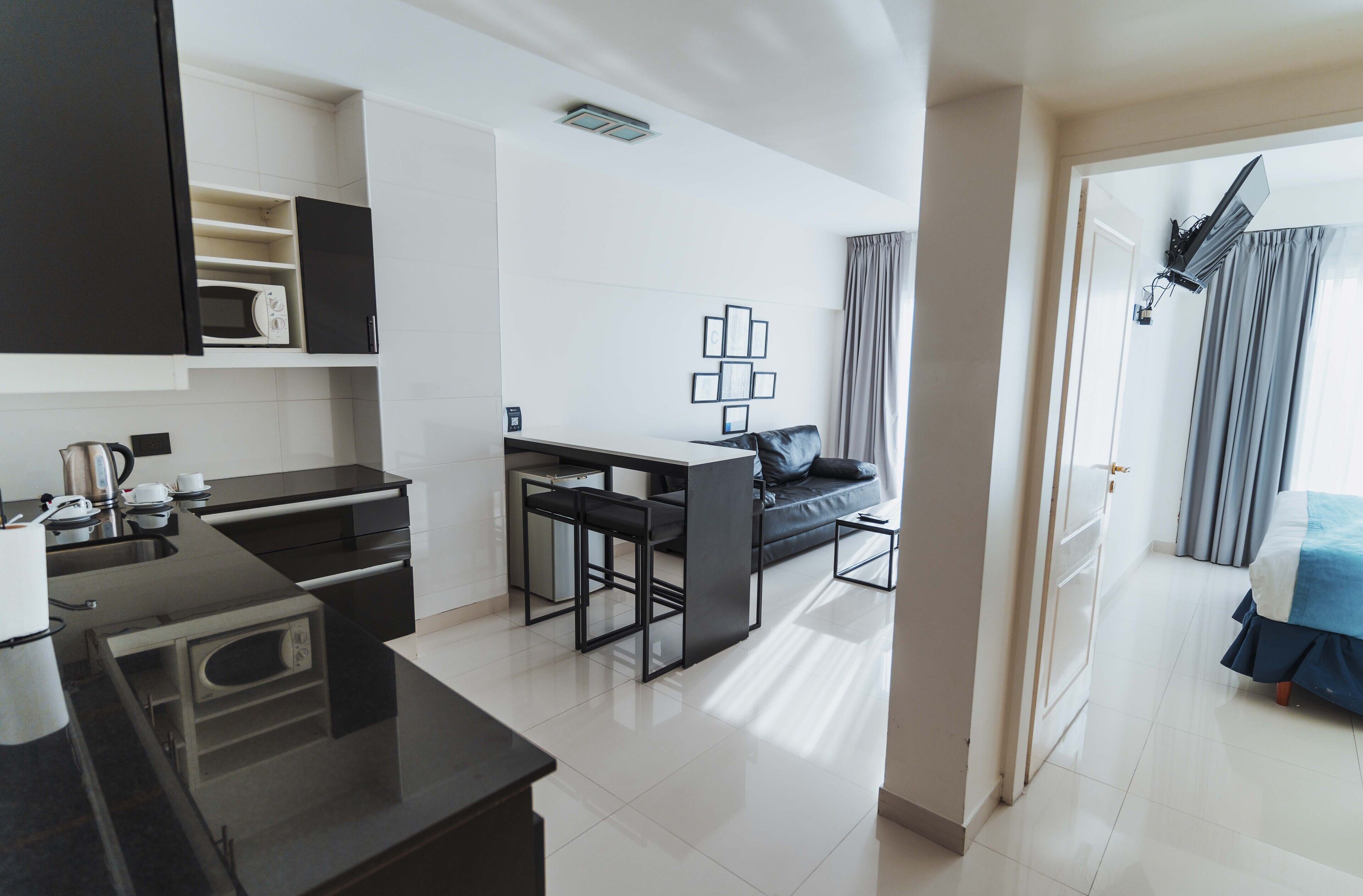 microwave, cookware/dishes/utensils, cleaning supplies, paper towels