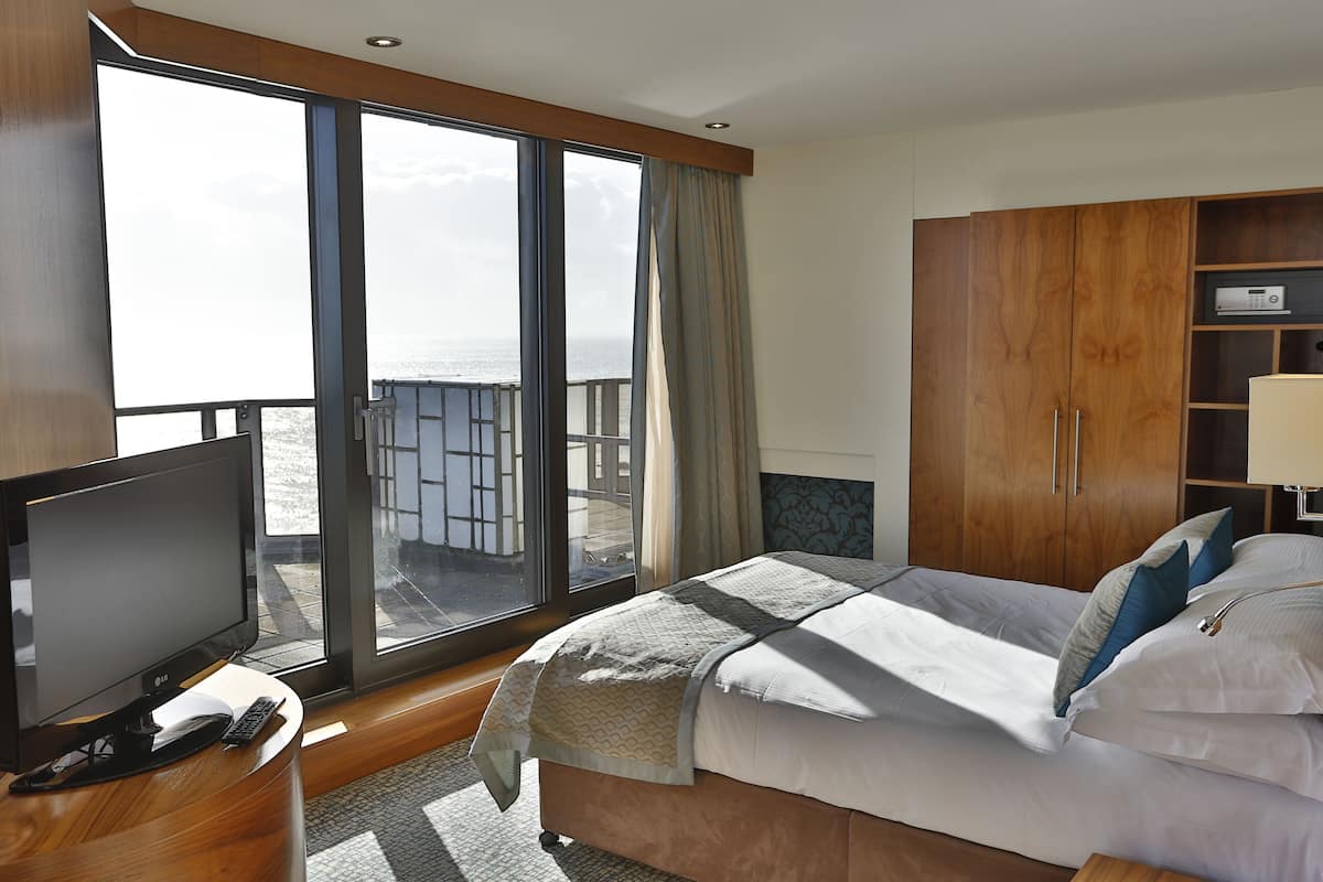 premium single room | in-room safe, desk, laptop workspace, iron/ironing board