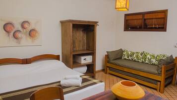 Standard Apartment | Minibar, in-room safe, individually decorated, iron/ironing board