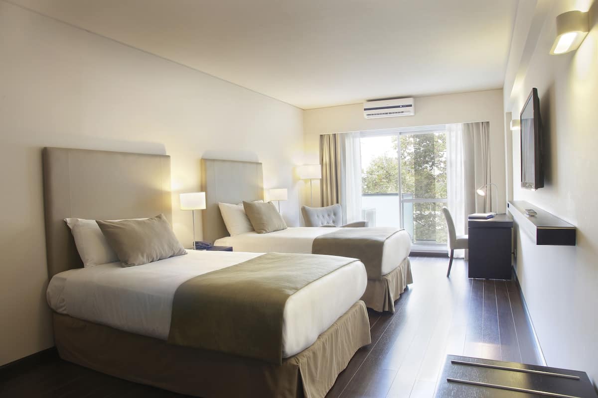 Premium bedding, pillow-top beds, minibar, in-room safe