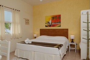 Double Room | Minibar, in-room safe, individually decorated, iron/ironing board