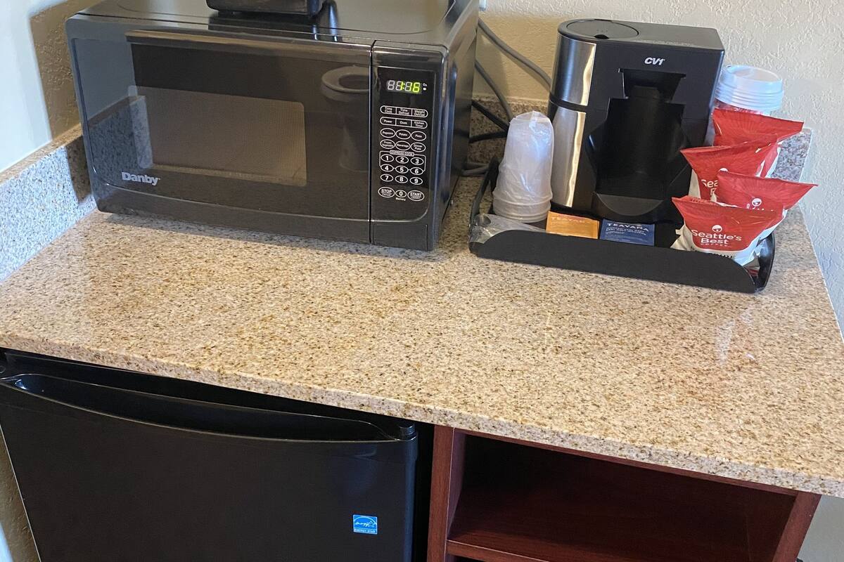 standard suite, 1 king bed, non smoking | living area | flat-screen tv, dvd player