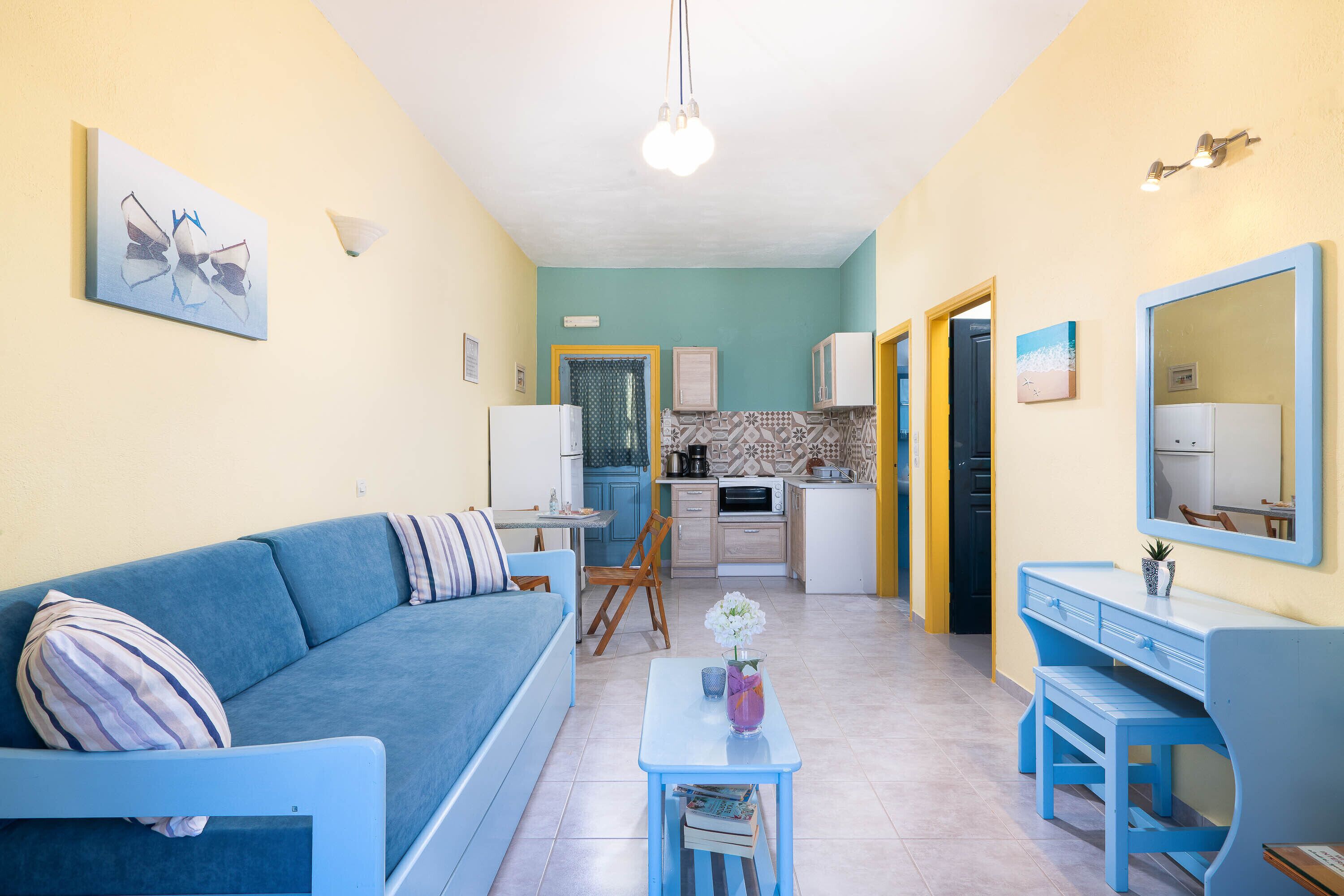Superior Apartment, Sea View | Living area | 22-inch flat-screen TV with cable channels, TV