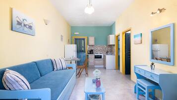Superior Apartment, Sea View | Living area | 22-inch flat-screen TV with cable channels, TV