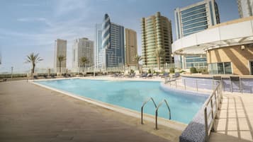 Outdoor pool, sun loungers, lifeguards on site