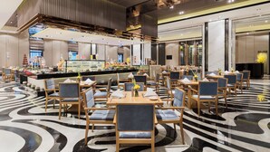 A modern hotel lobby with a central bar area, multiple seating arrangements, and a distinctive black and white patterned floor. - Nanjing Wanda Realm Hotel (Nanjing)