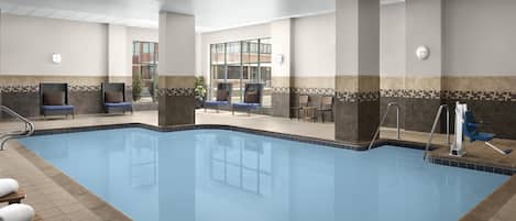 Ein Schwimmbecken mit Liegestühlen und Fliesenboden.