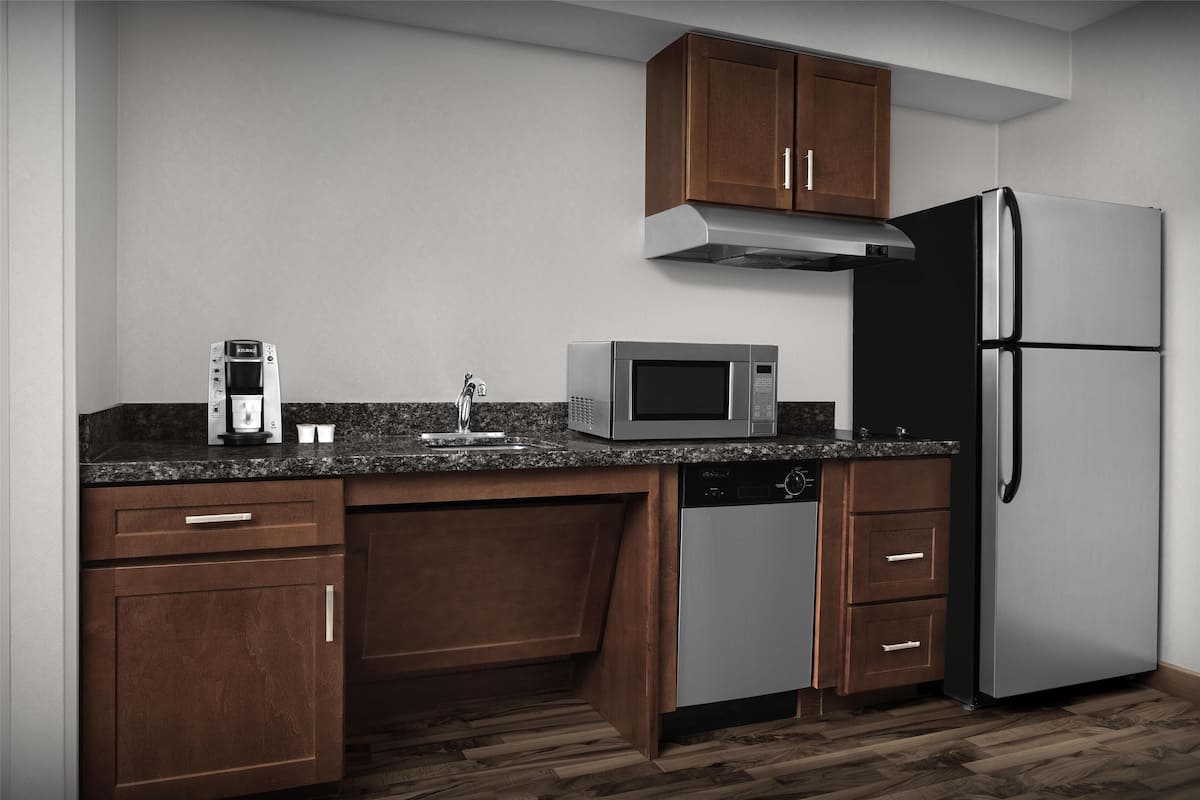 full-sized fridge, microwave, stovetop, dishwasher