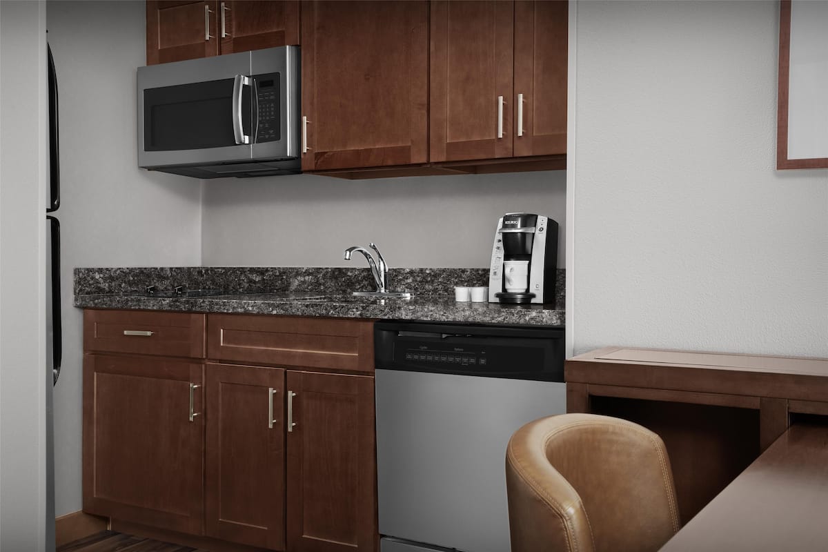 full-sized fridge, microwave, stovetop, dishwasher
