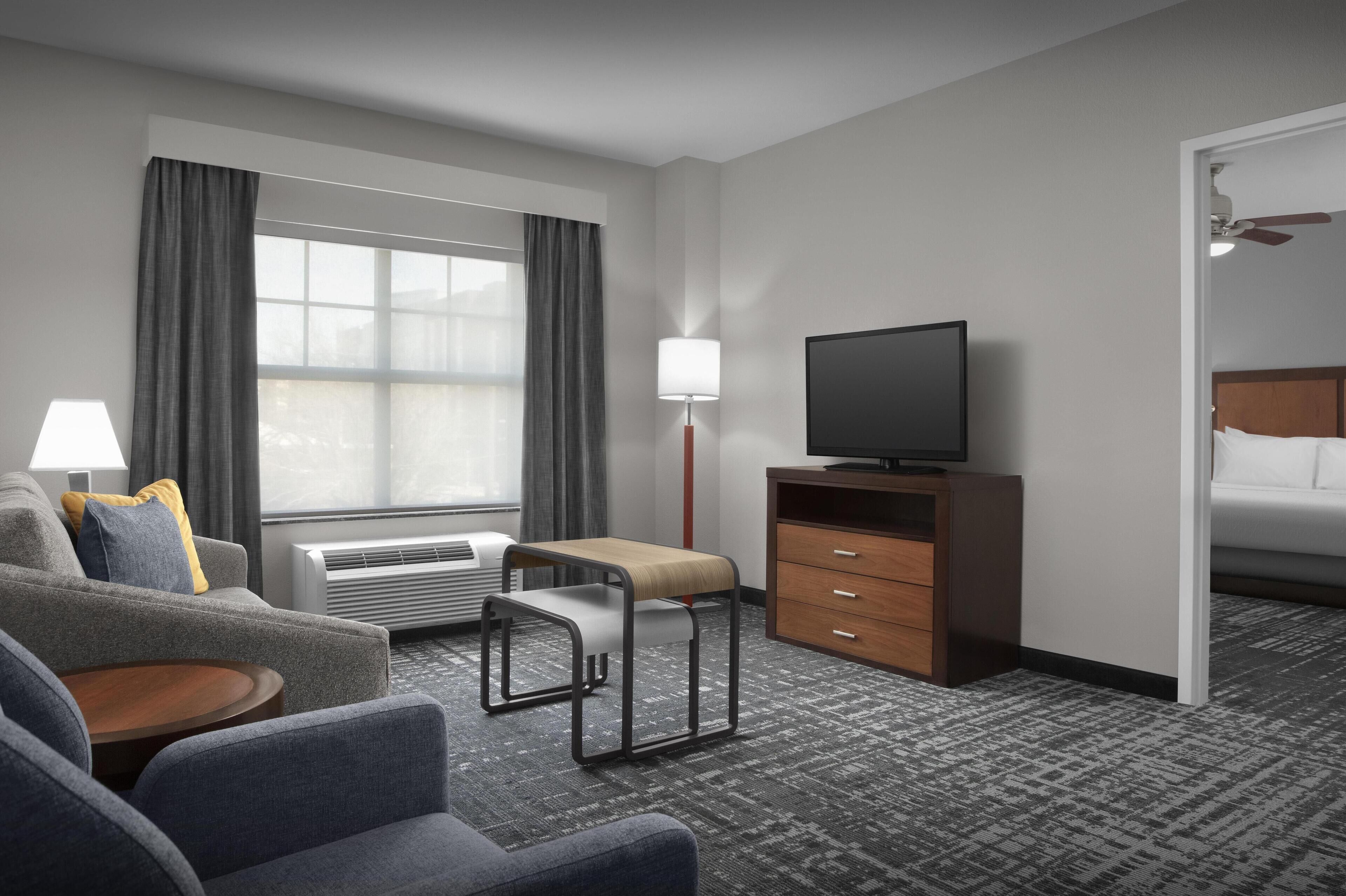 1 King bed, 2 Queen Two Bedroom, Non Smoking | Living area | 50-inch flat-screen TV with satellite channels, TV