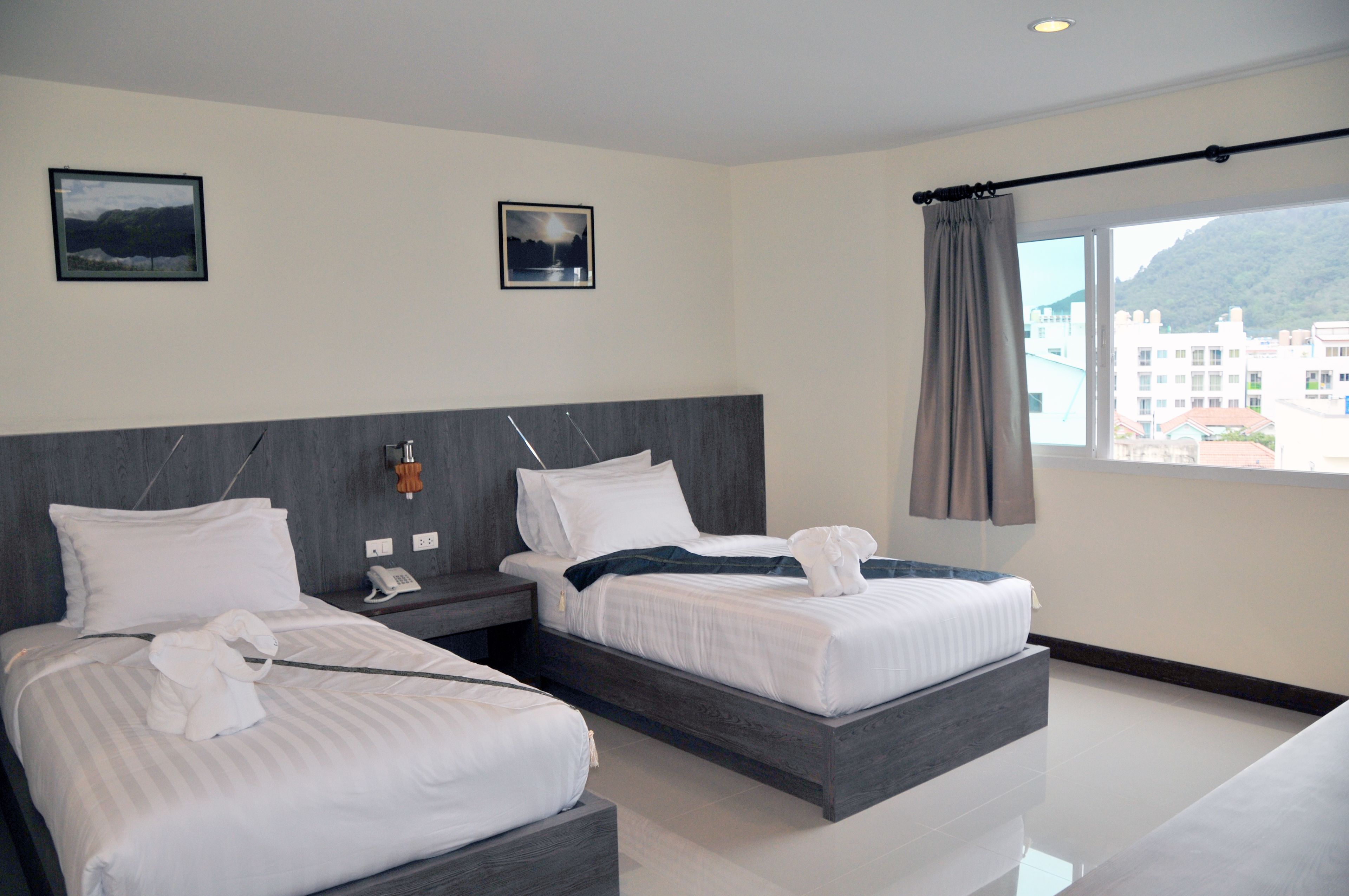 superior twin room | minibar, in-room safe, desk, blackout curtains