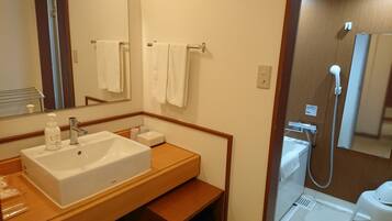 A bathroom with a white sink, mirror, and towel rack.