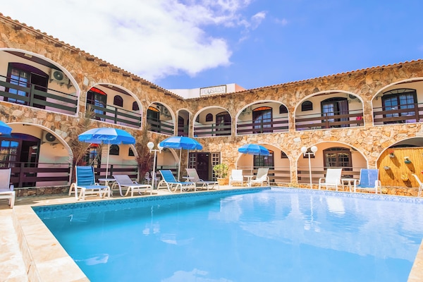 Outdoor pool, open 10:00 AM to 10:00 PM, pool umbrellas, sun loungers