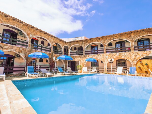 Outdoor pool, open 10:00 AM to 10:00 PM, pool umbrellas, pool loungers