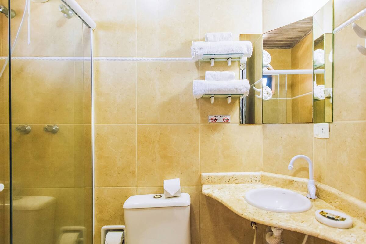 family room | bathroom | shower, designer toiletries, hair dryer, towels