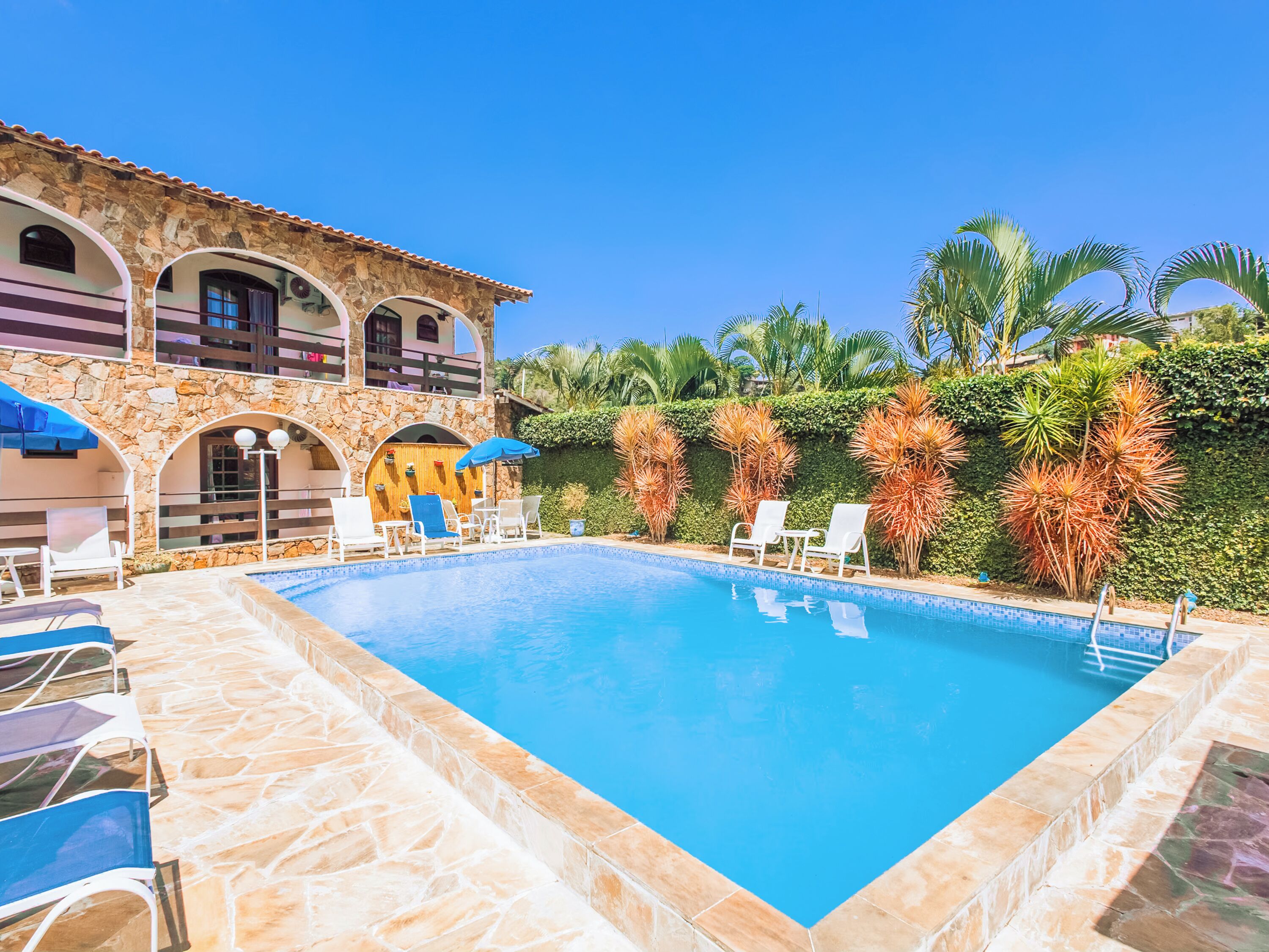 Outdoor pool, open 10:00 AM to 10:00 PM, pool umbrellas, pool loungers